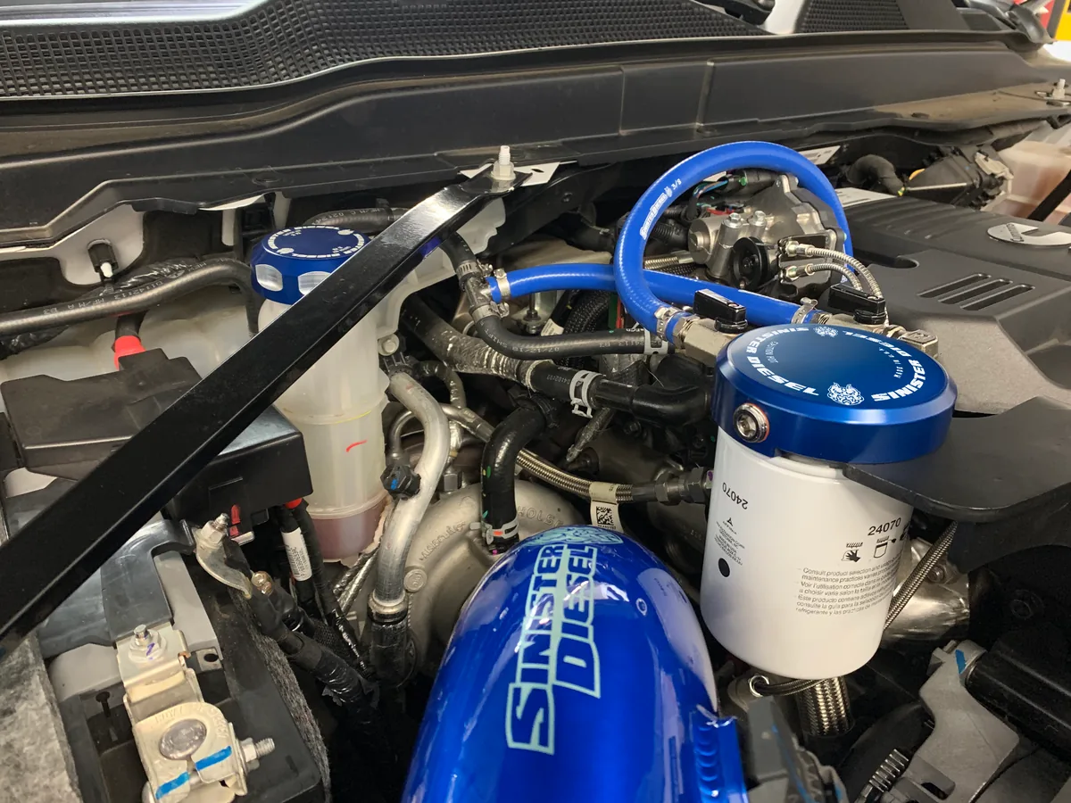 Sinister Diesel coolant filtration kit installed in Ram engine bay